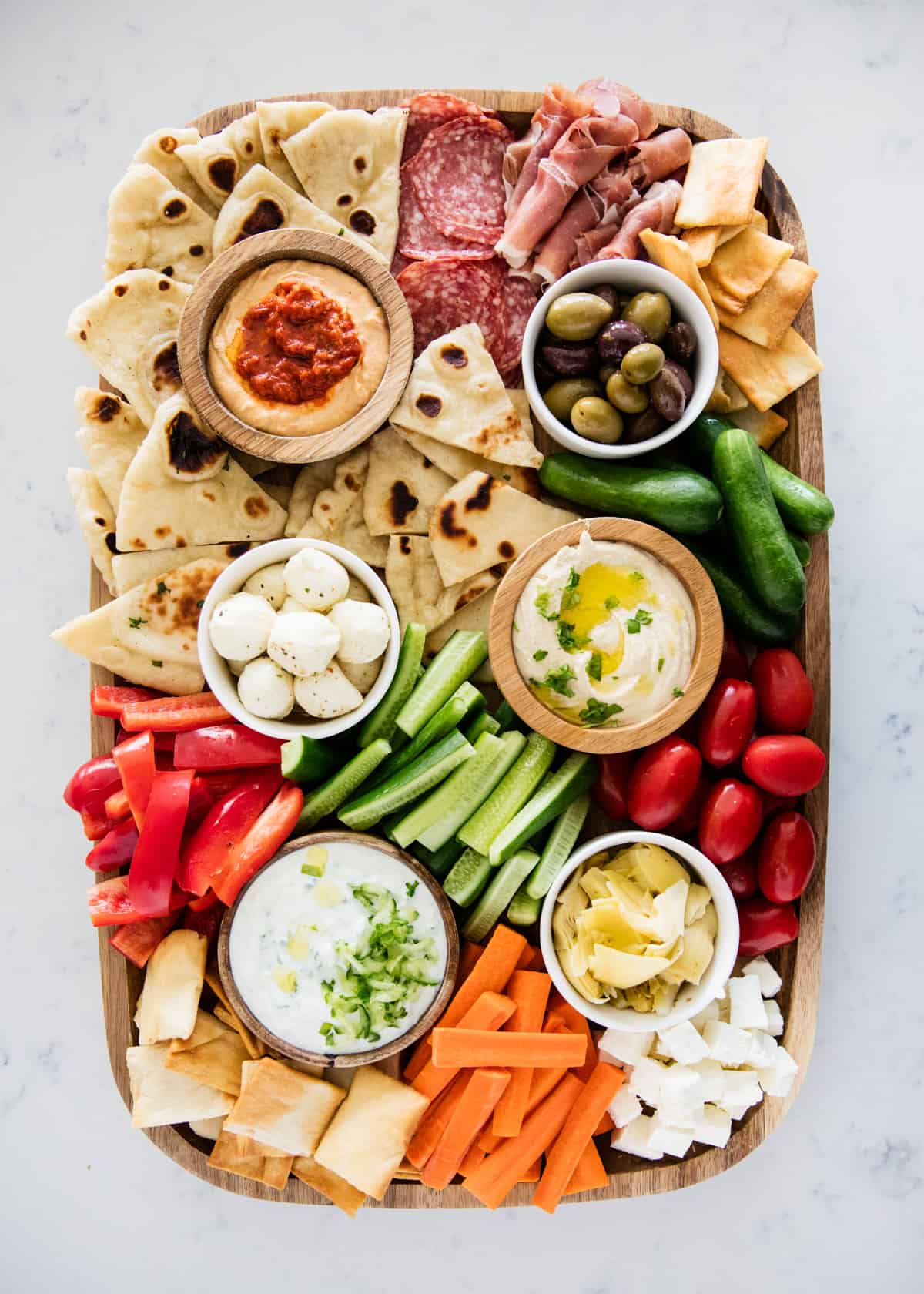 Mezze platter on marble counter.