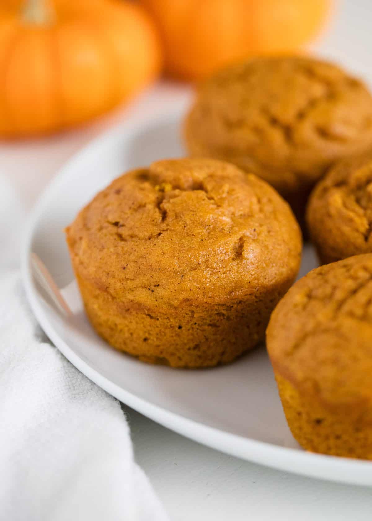 Pumpkin muffins on plate.