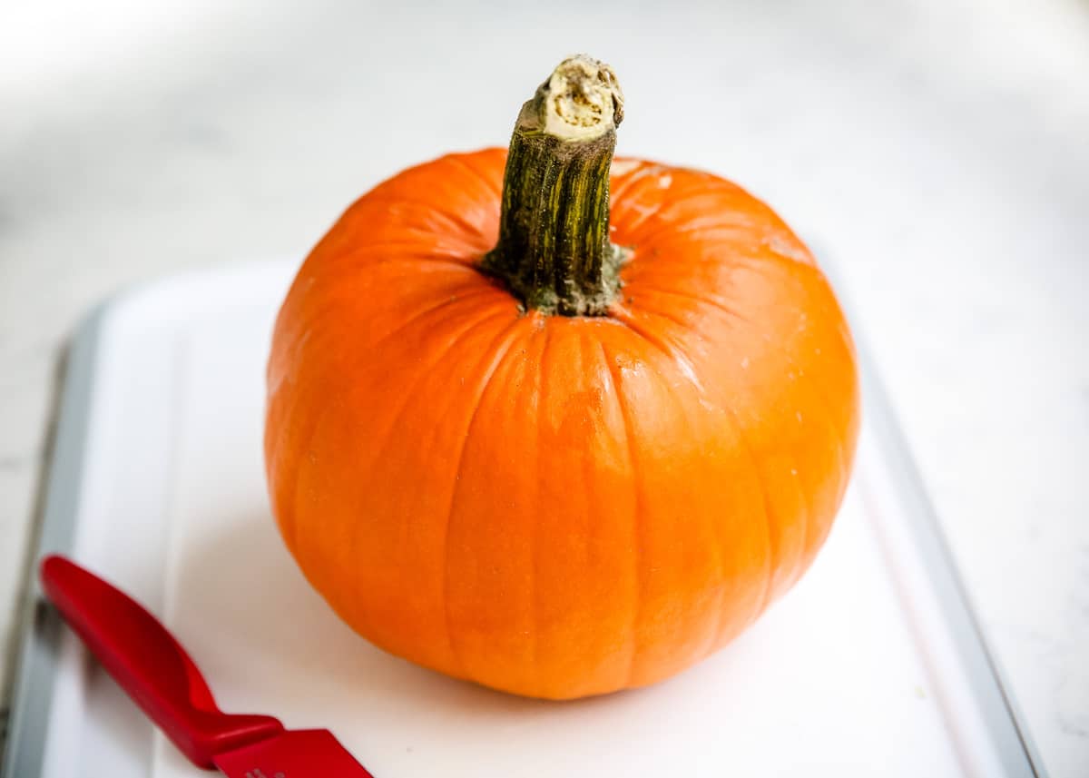 Pumpkin on cutting board.