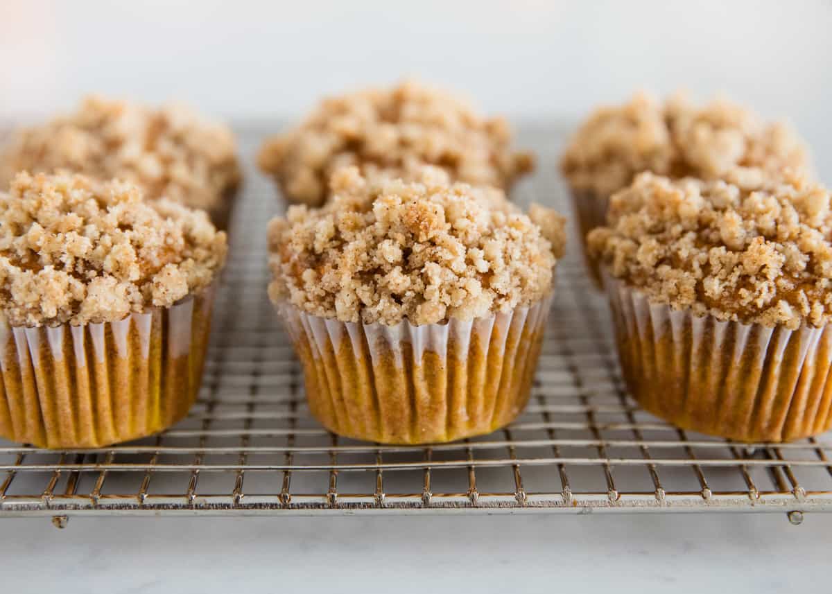 Pumpkin crumb muffins on cooling rack.