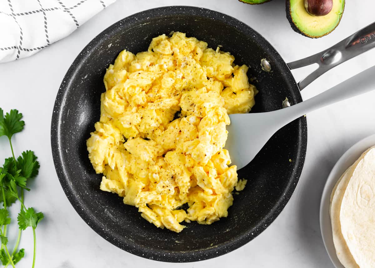 Scrambled eggs in pan.