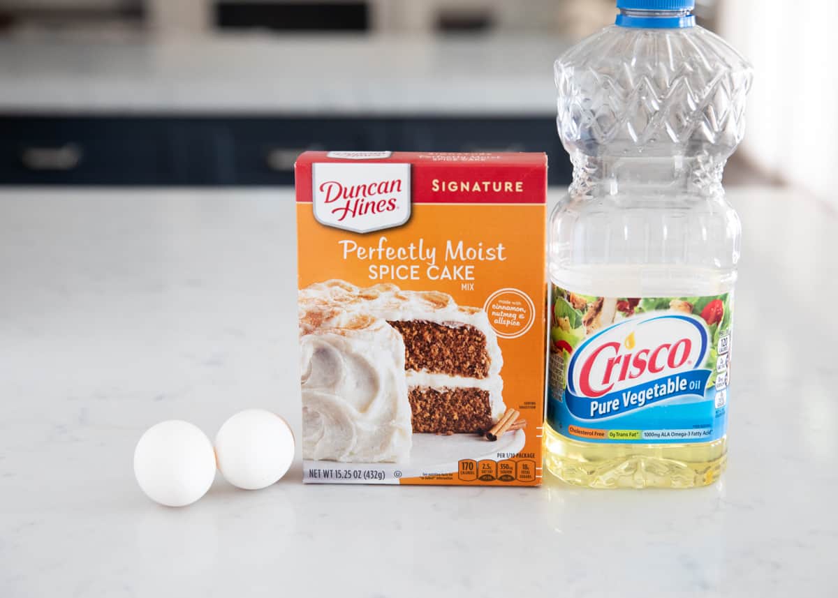 Spice cake mix cookie ingredients on counter.