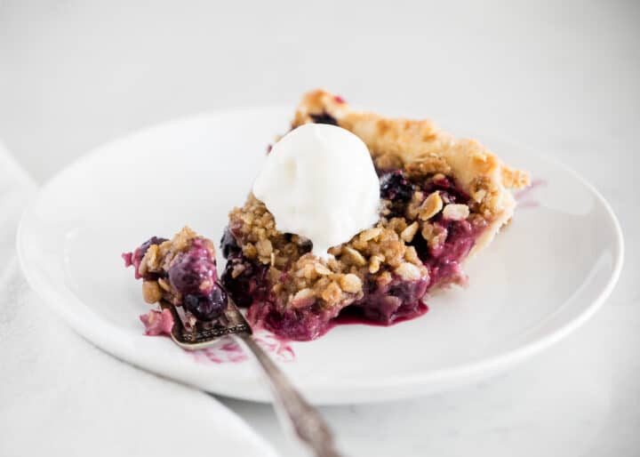 Berry crumble pie on plate.