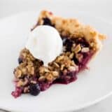 sliced berry pie on white plate