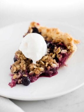 sliced berry pie on white plate