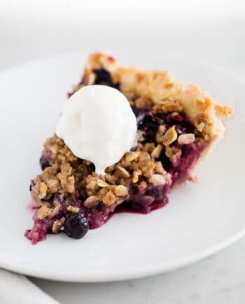 sliced berry pie on white plate