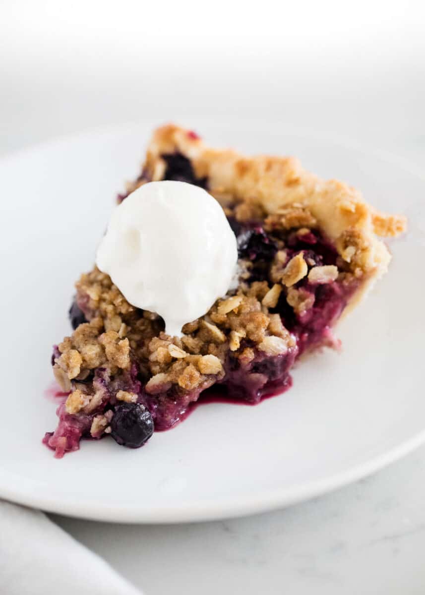 sliced berry pie on white plate