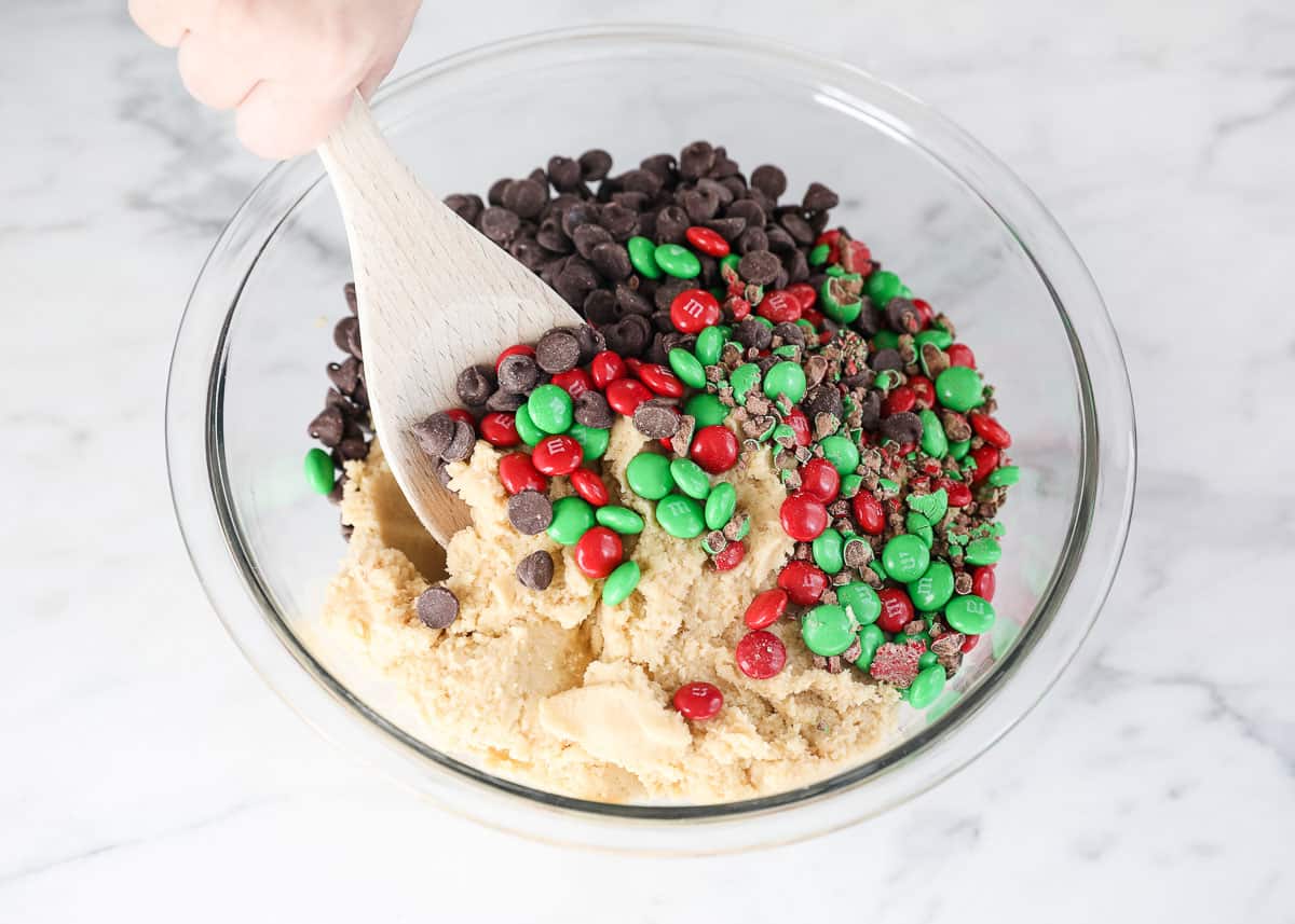 Mixing M&M Christmas cookie dough.