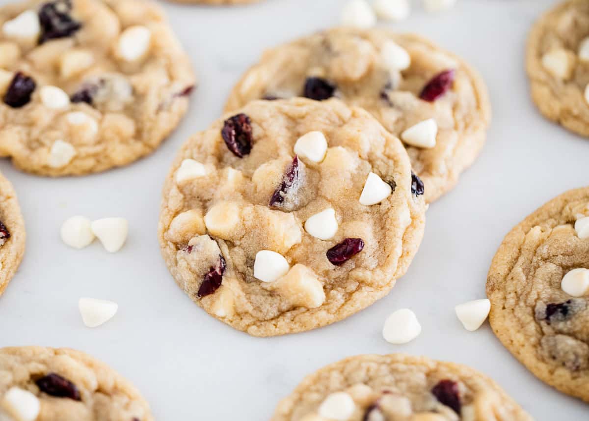 White chocolate cranberry cookies are soft, chewy, and chunky loaded with white chocolate and dried cranberries. A delicious festive cookie perfect for the holidays! White chocolate cranberry cookies on counter.