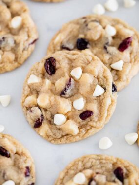 Soft baked white chocolate cranberry cookies with visible white chocolate chips and cranberries.