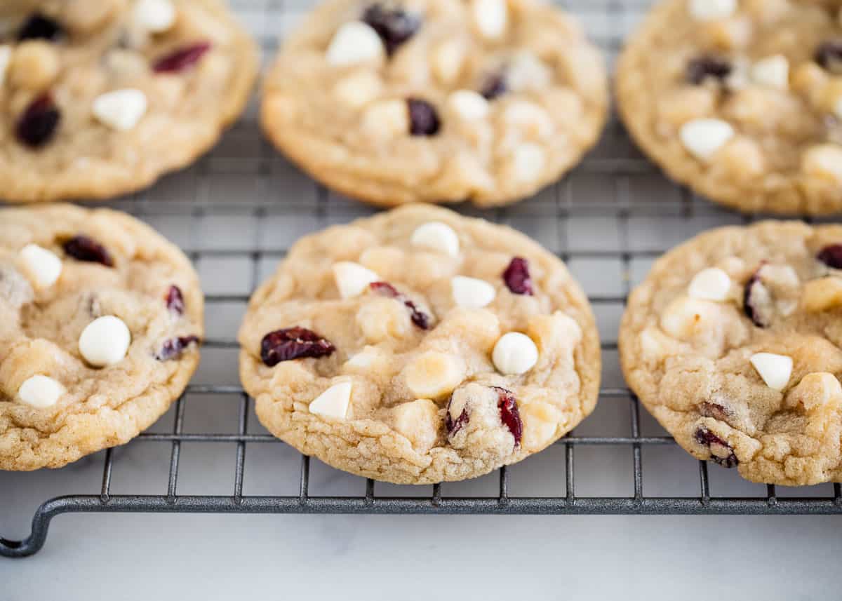 White chocolate cranberry cookies on cooling rack.