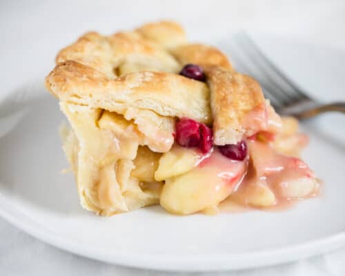 apple cranberry pie on white plate
