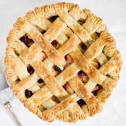 apple cranberry pie on white table