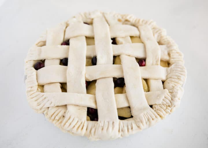 apple cranberry pie on table