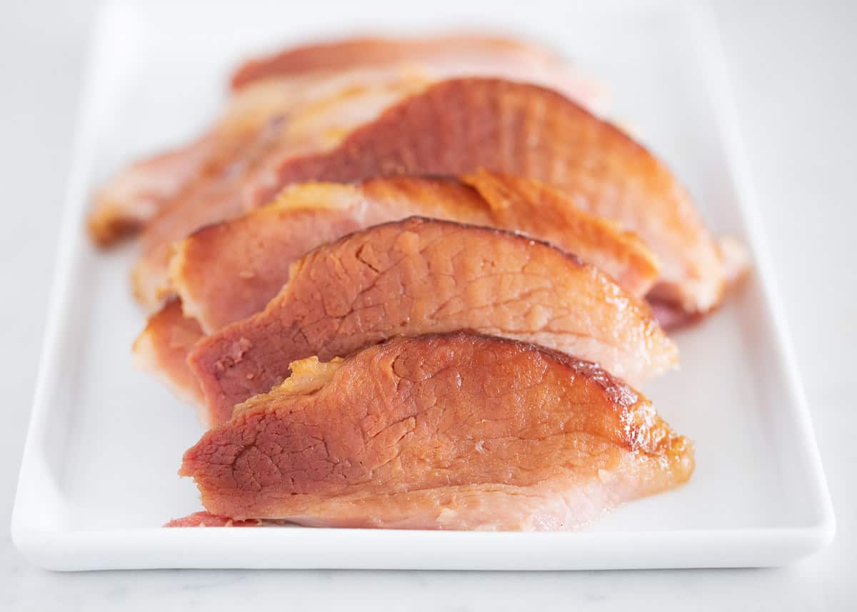 Sliced ham on plate.