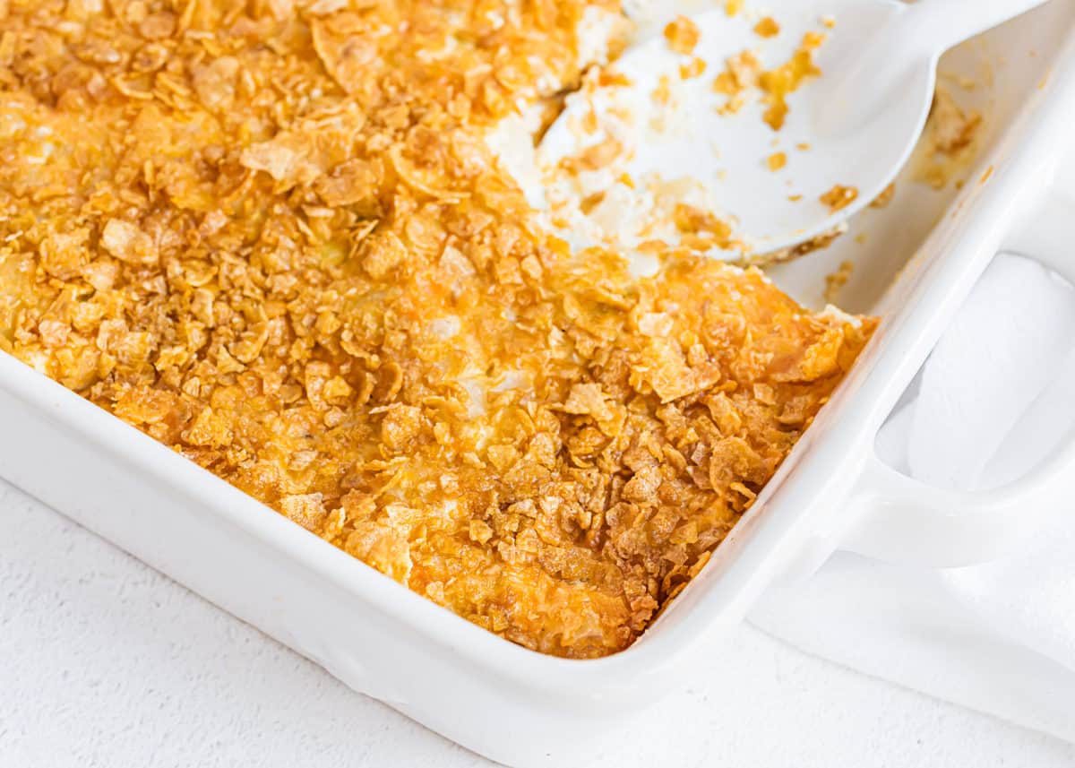 White pan with cheesy potatoes.