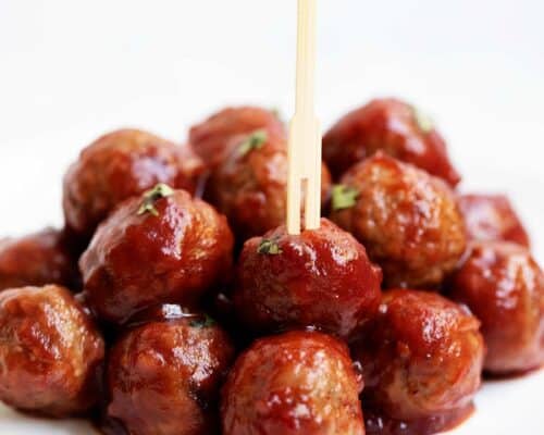 cranberry chili meatballs on white plate