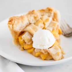 slice of peach pie with ice cream