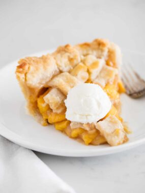slice of peach pie with ice cream