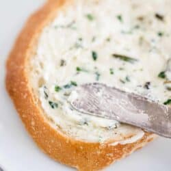 herb butter spread onto bread