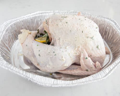 turkey with herb butter in pan