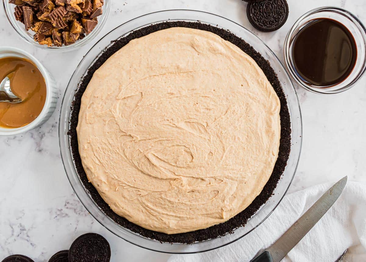 Oreo peanut butter pie on counter.