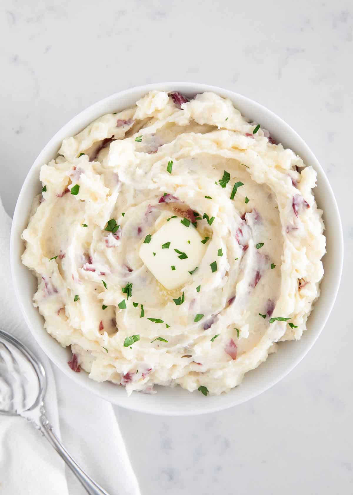 Red mashed potatoes in bowl.