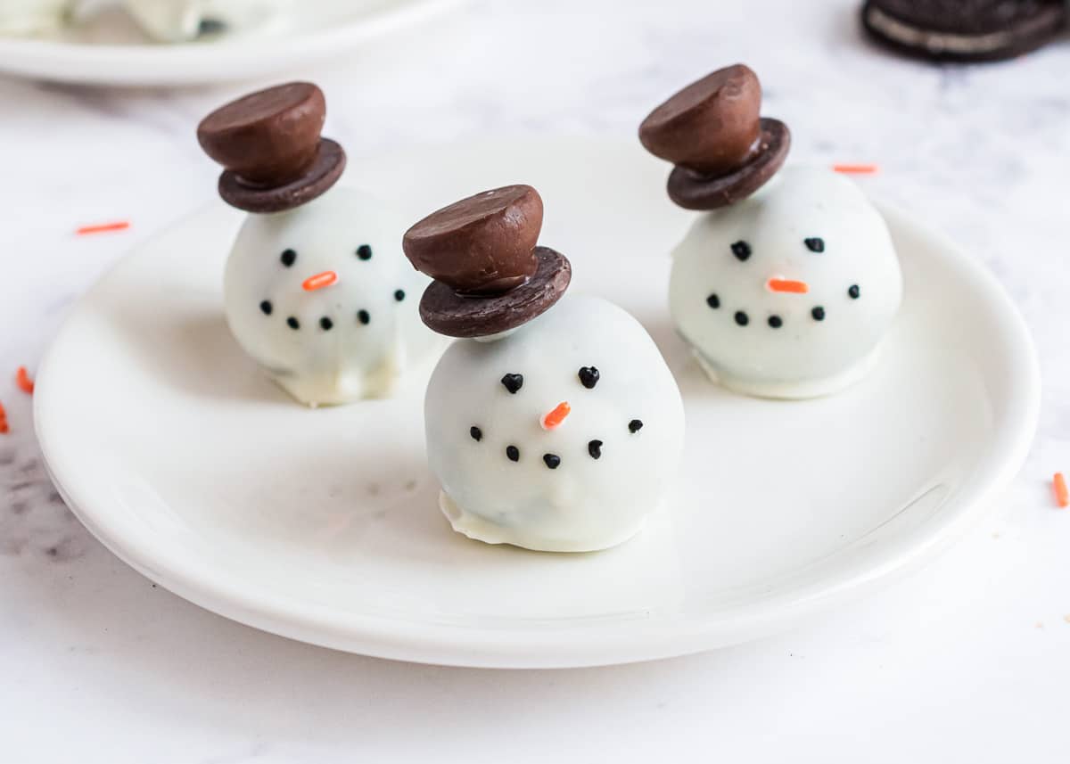 snowman oreo balls on plate