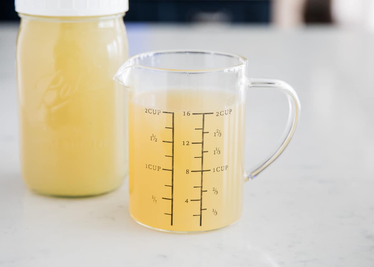 Turkey stock in measuring cup.