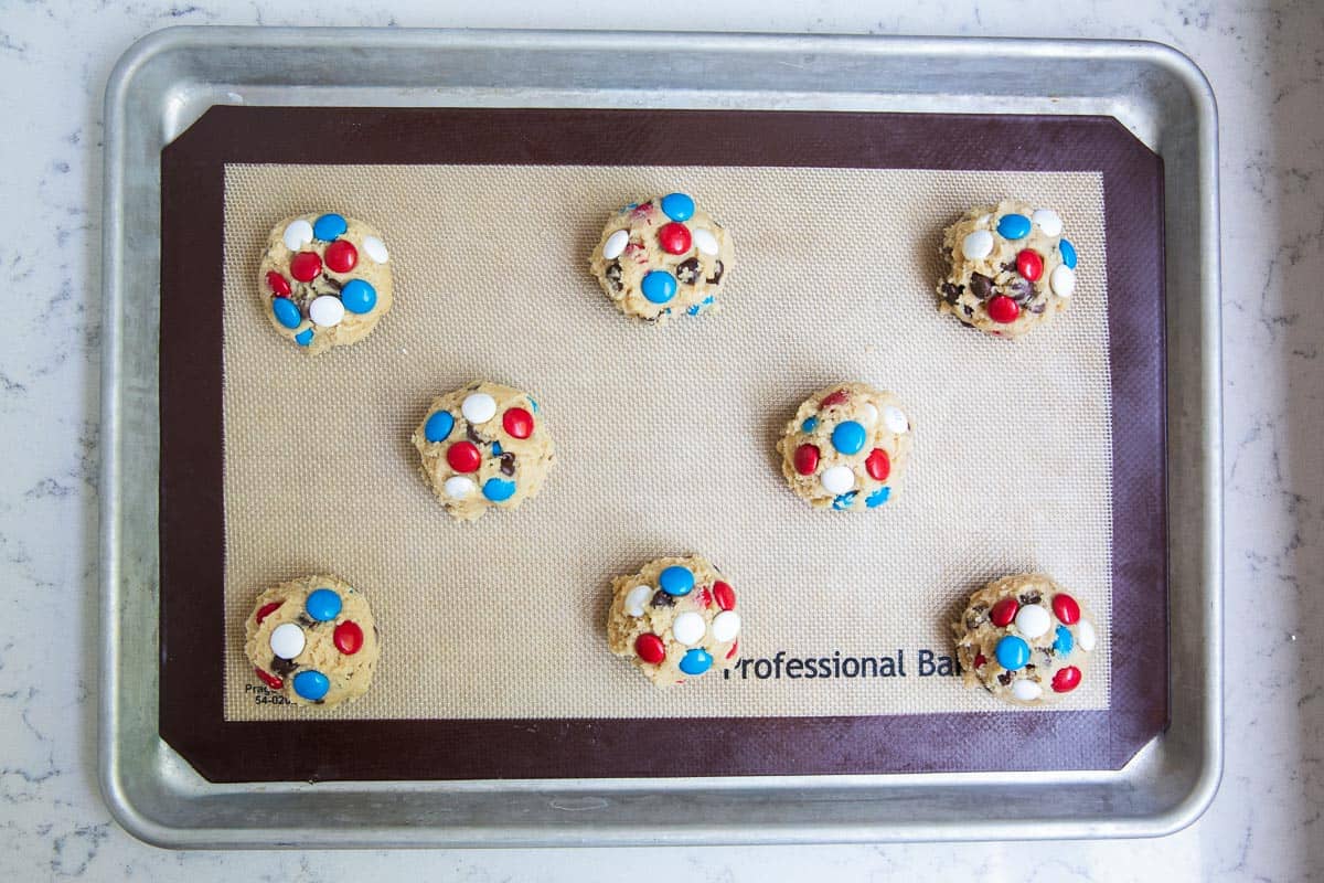 M&M cookie dough on pan.