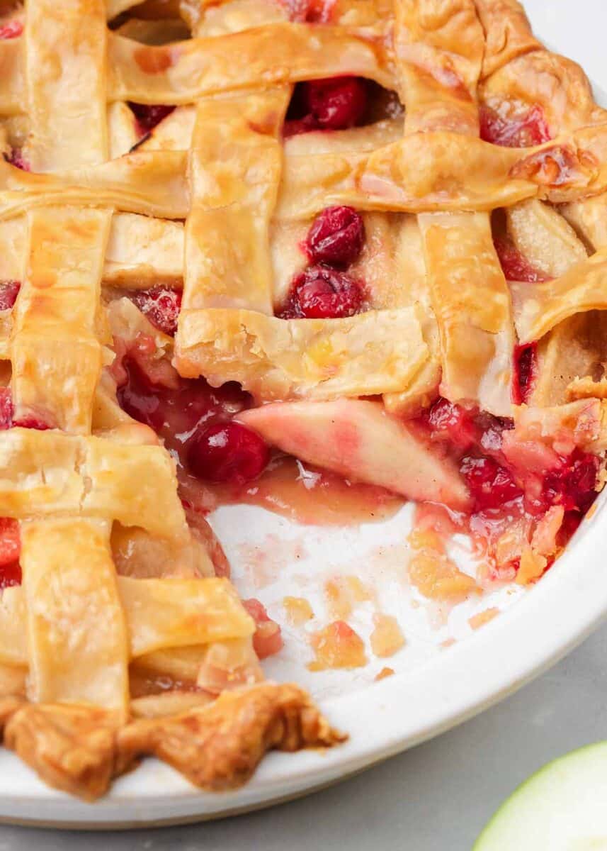 Apple cranberry pie on the counter.