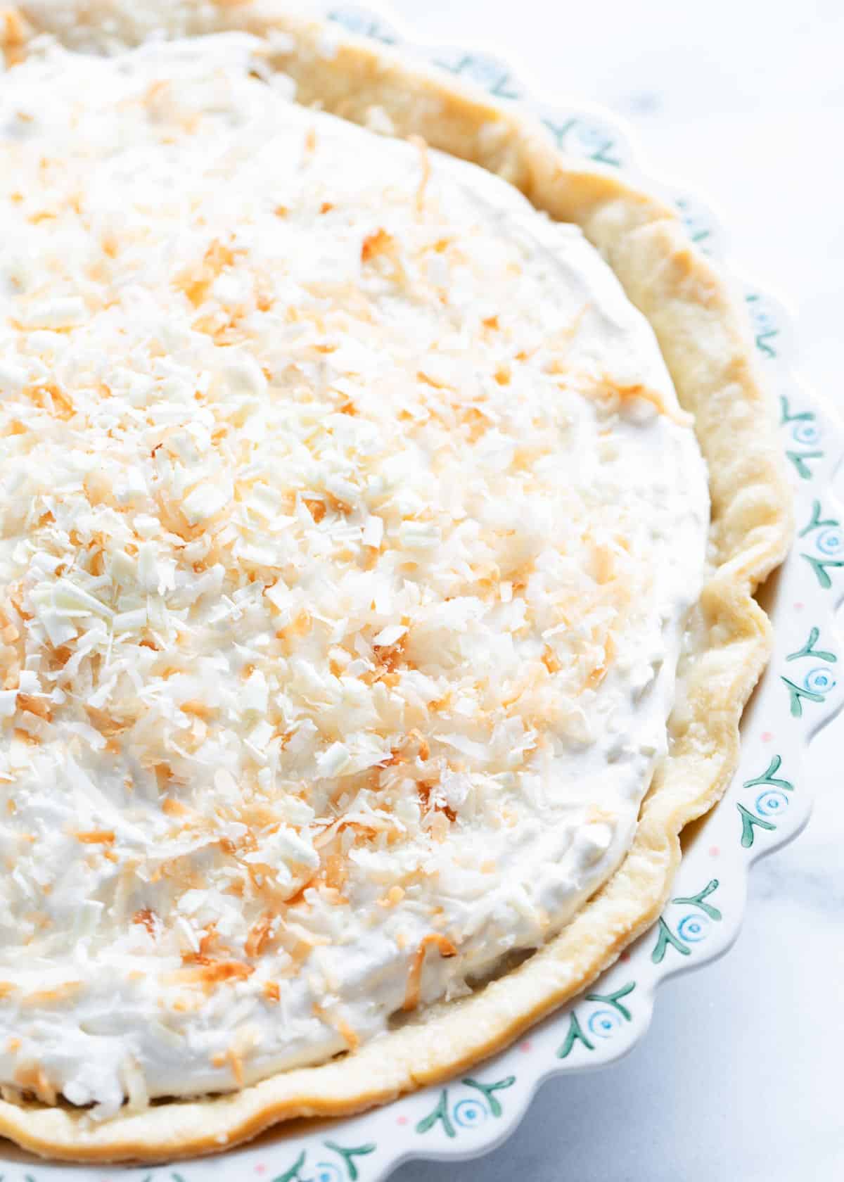 Coconut cream pie on counter.