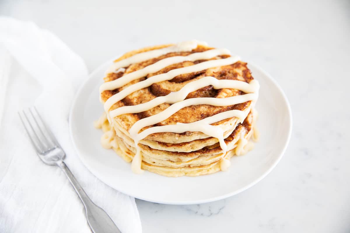 Cinnamon roll pancakes on plate.