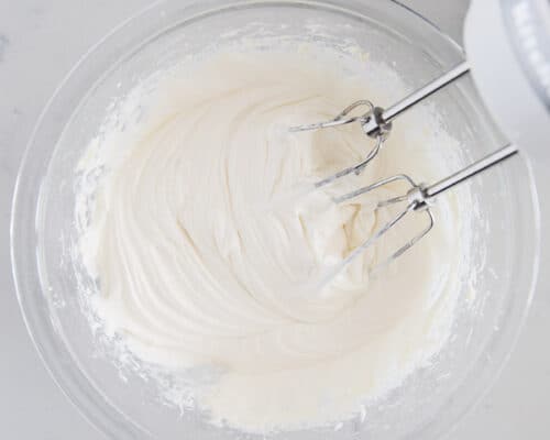 mixing cream cheese glaze