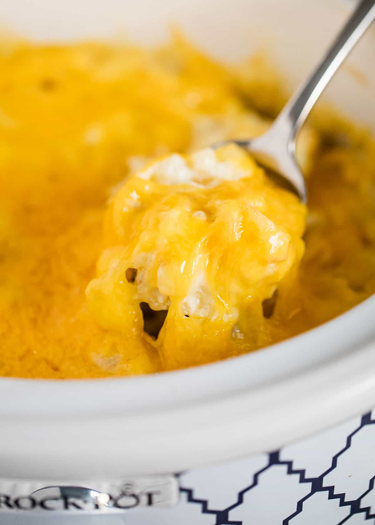 Spoonful of cheesy potatoes.