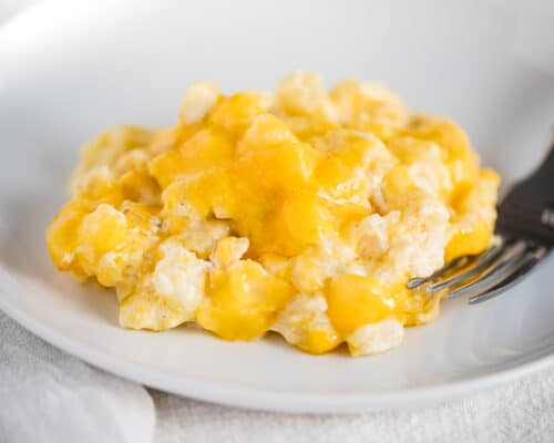 cheesy potatoes on white plate