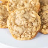 Oatmeal cookies on a white plate.