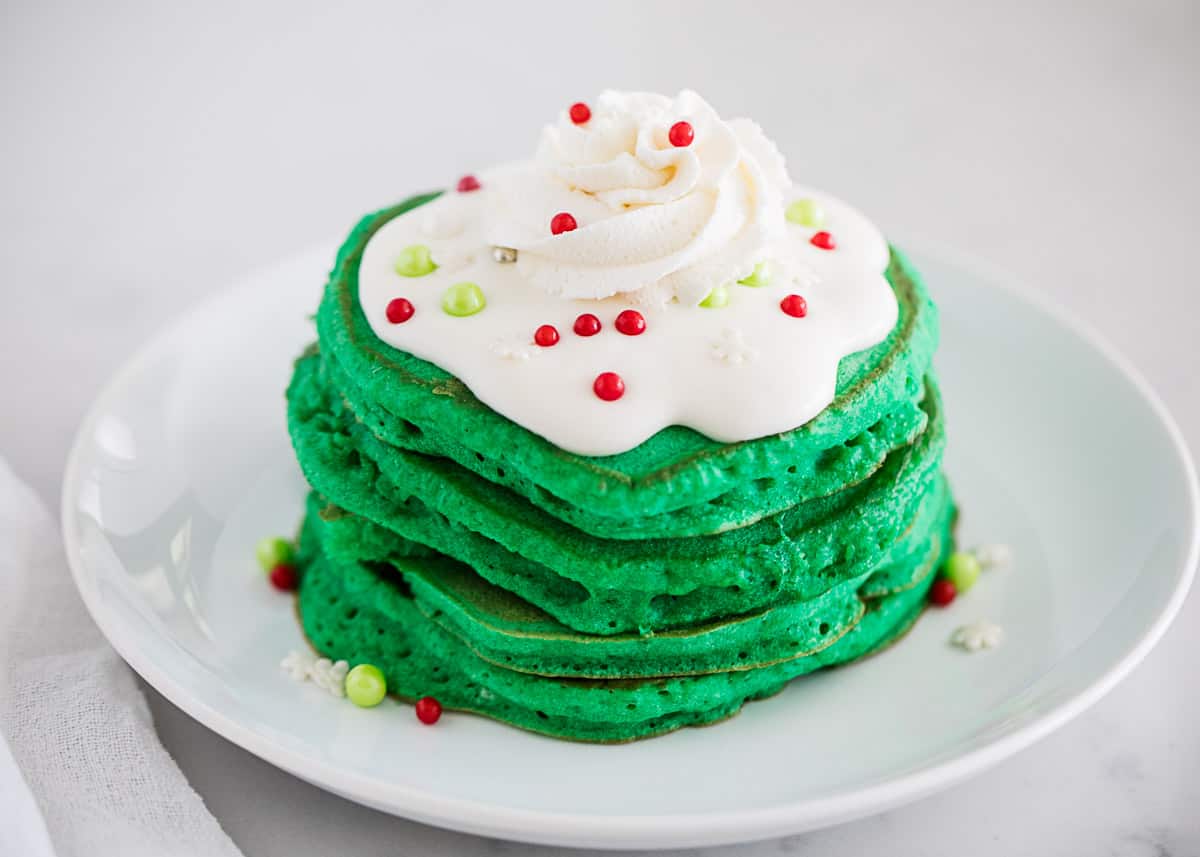 Elf on the shelf pancakes on white plate.