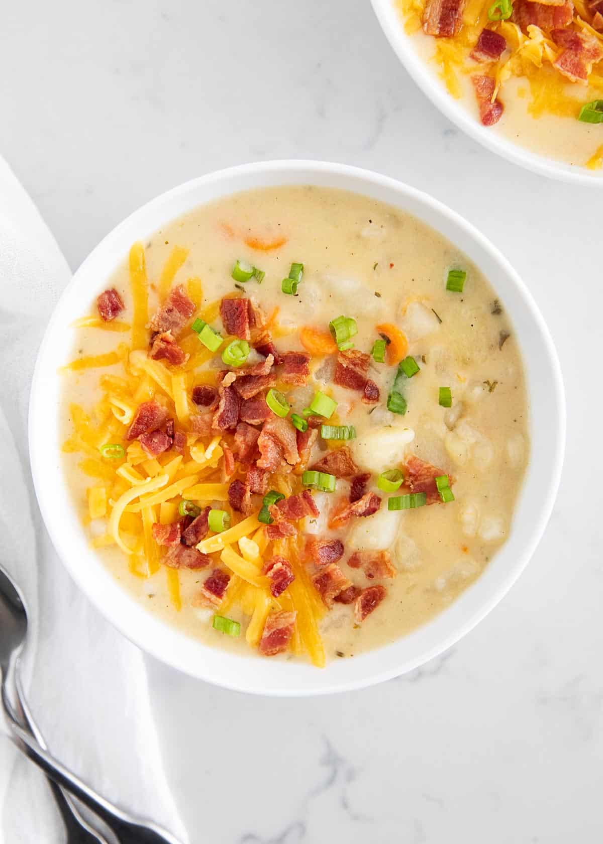 Bowl full of loaded potato soup.