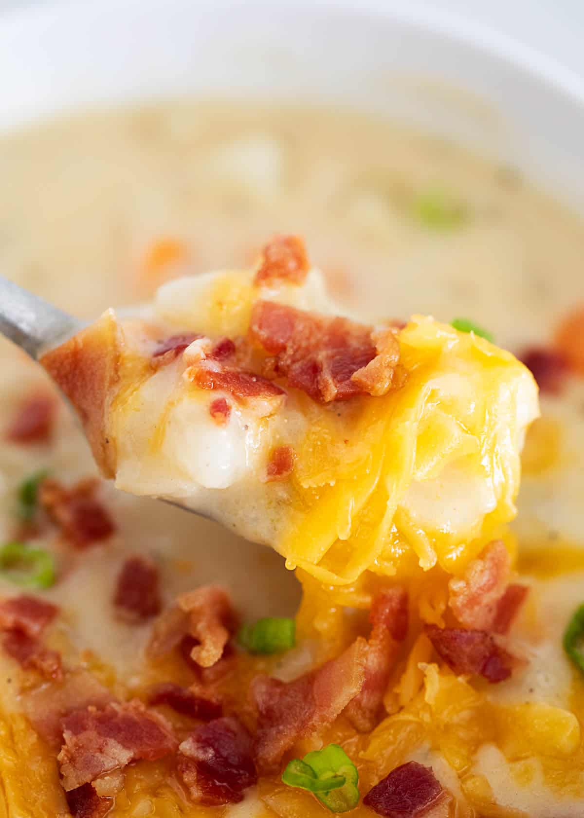 Spoonful of loaded potato soup.