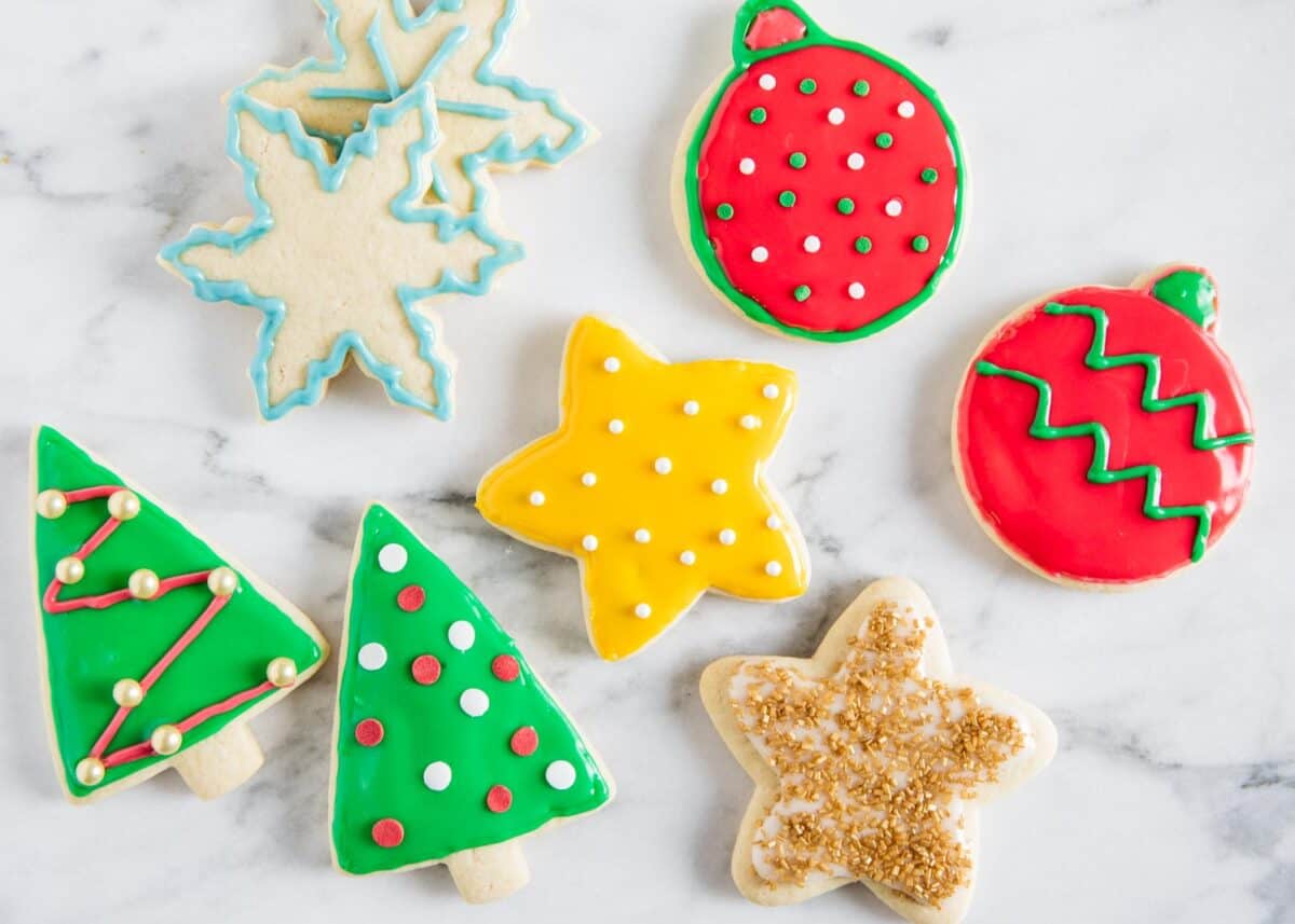 Cookies with sugar cookie icing on the counter..