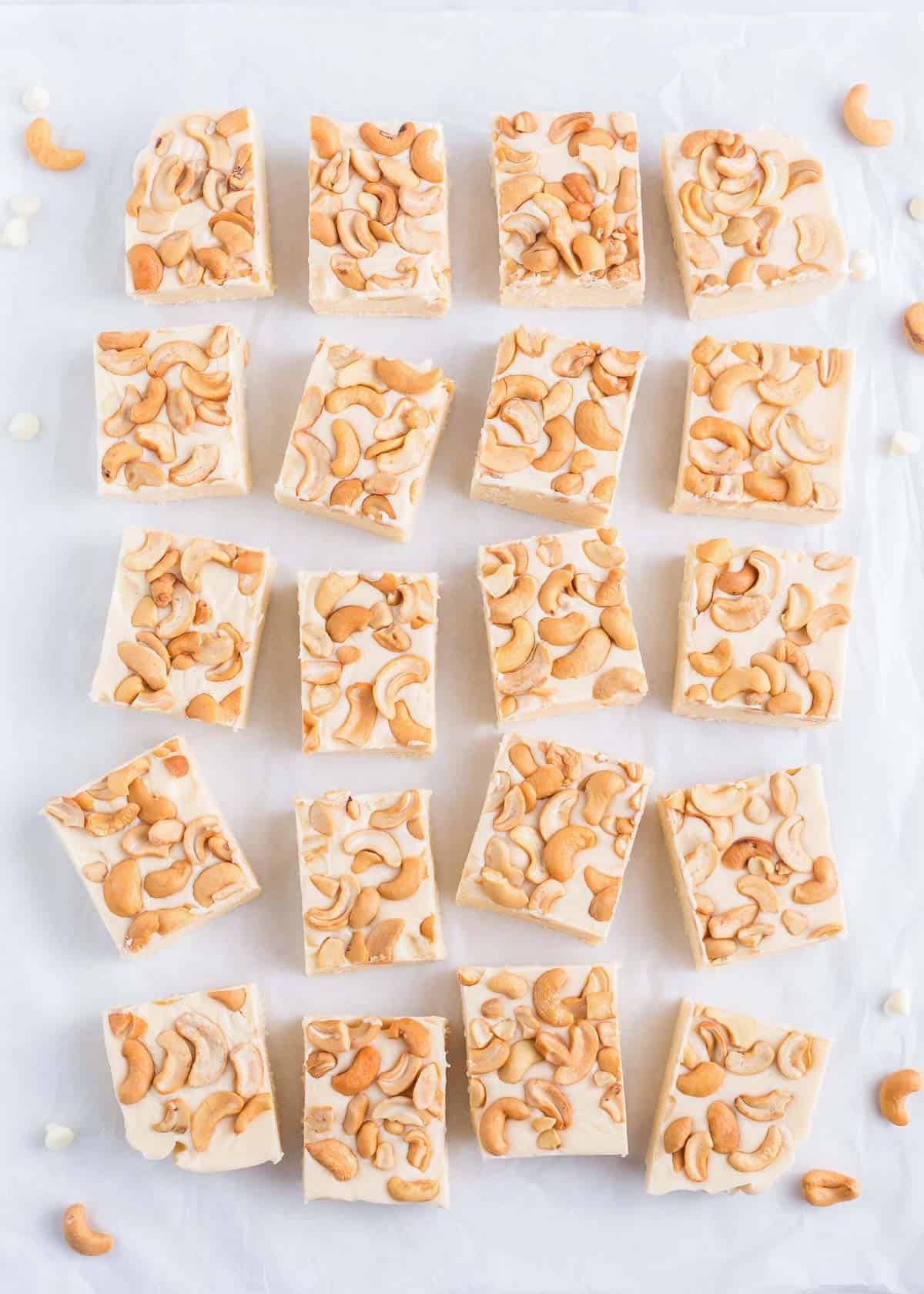 Sliced white fudge with cashews.