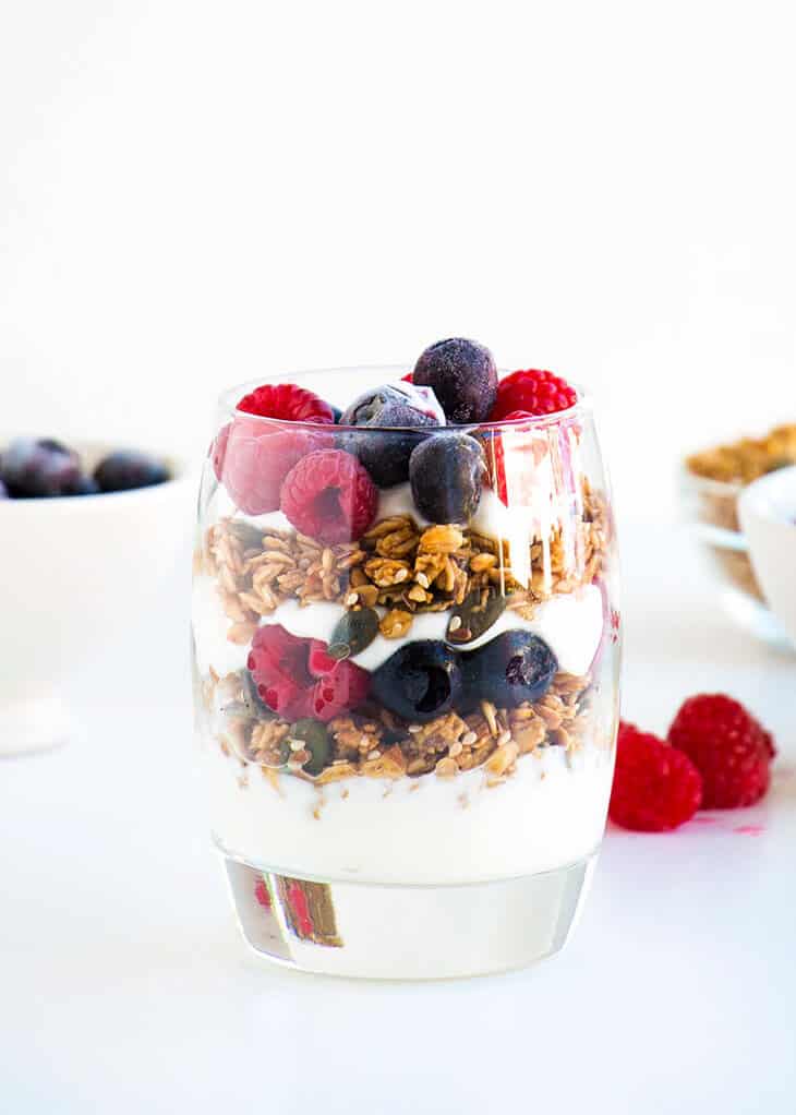 Yogurt parfait in glass cup.