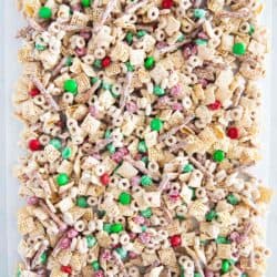 Christmas chex mix on parchment paper.