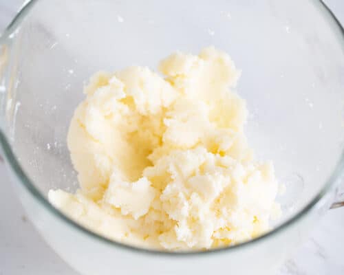 butter and sugar in glass bowl