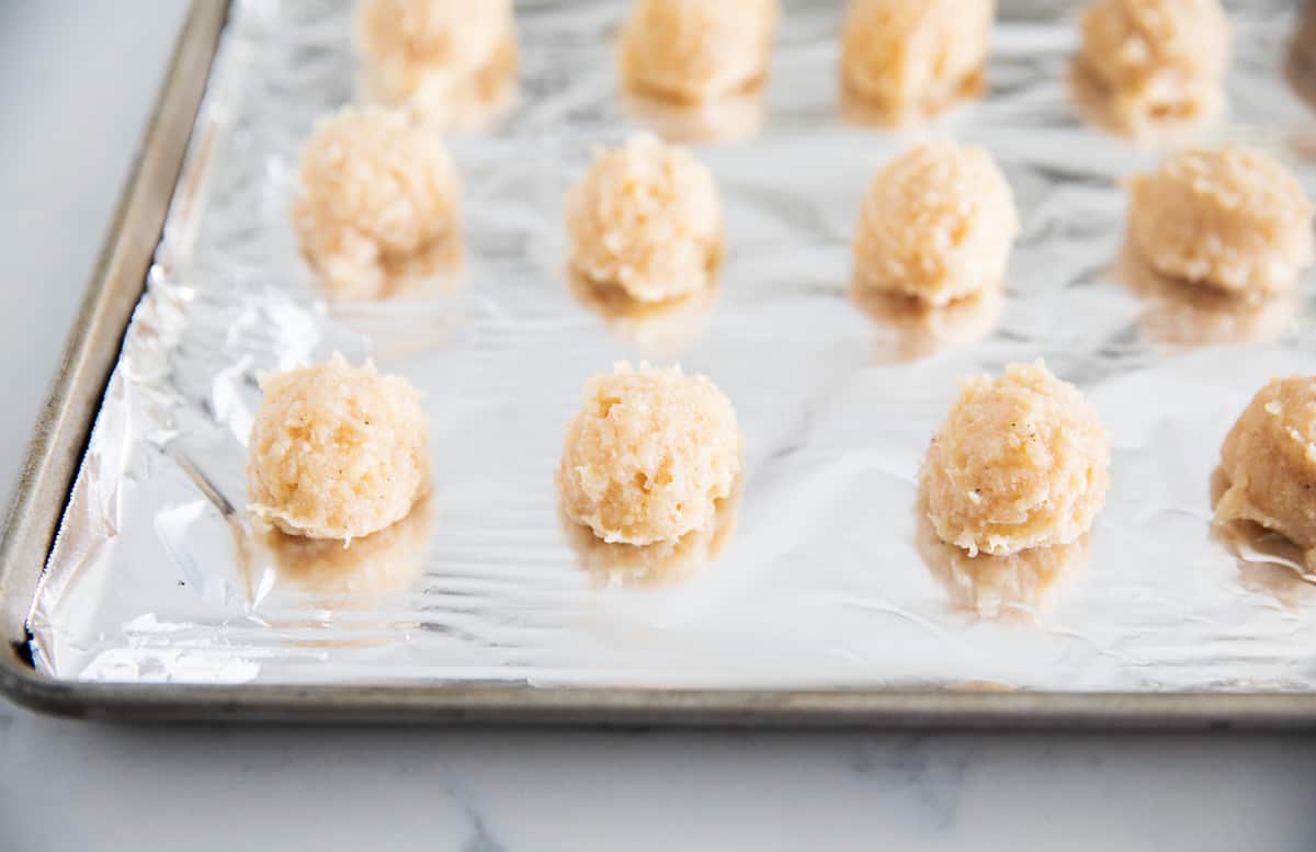 Chicken meatballs on a sheet pan with aluminum foil. 