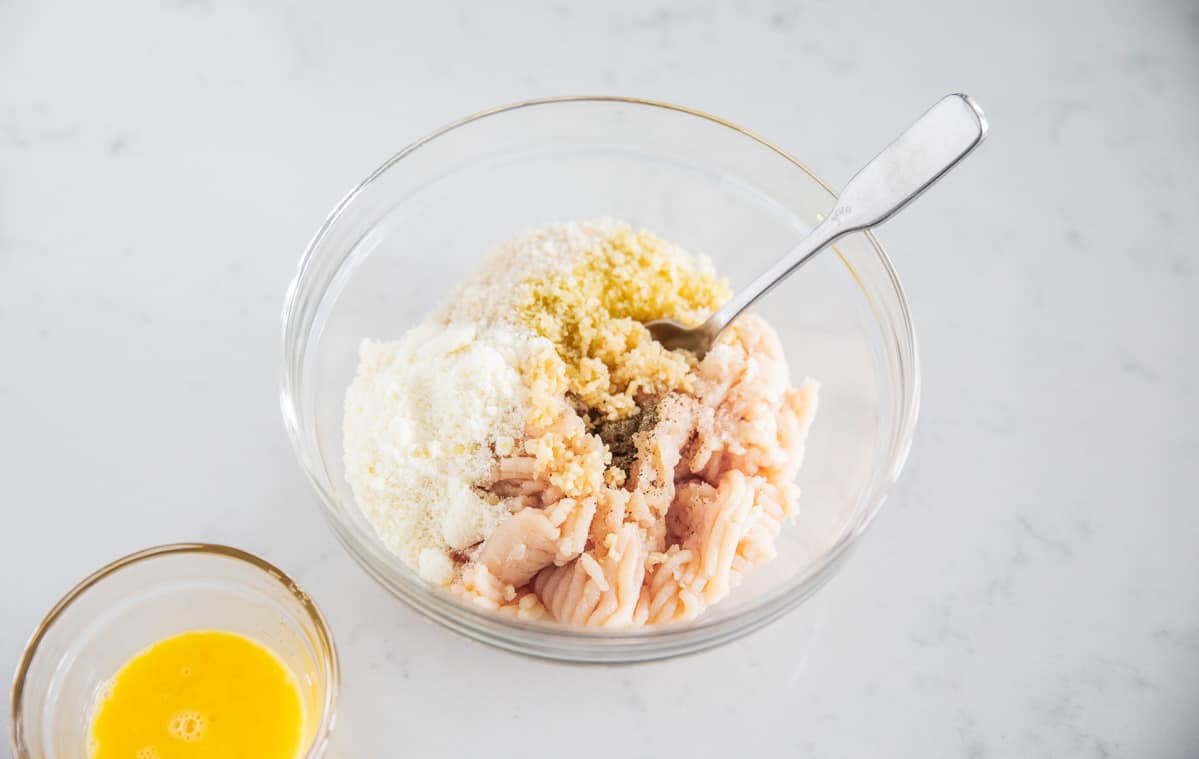 Chicken meatball ingredients in bowl.