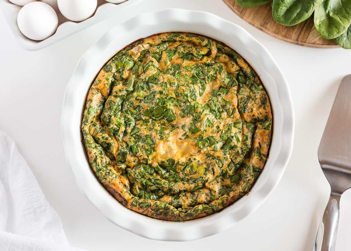 Spinach quiche in pan.