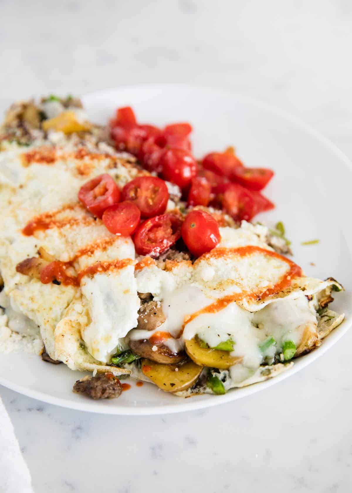 Egg white omelette with tomatoes on top.