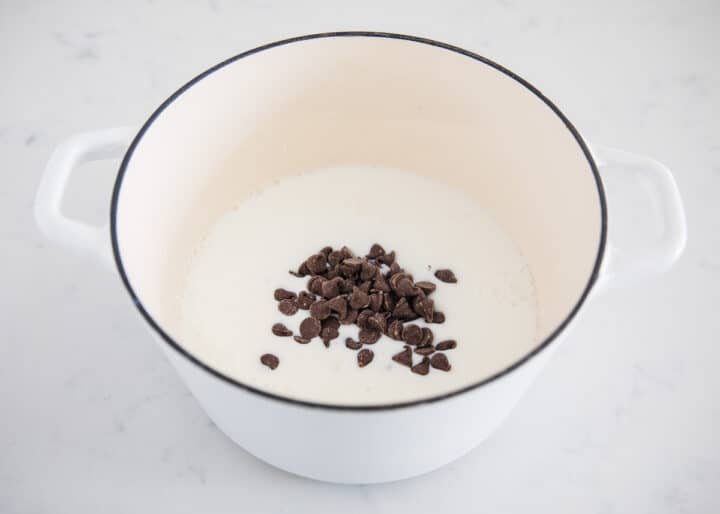 A rich and creamy homemade hot chocolate that tastes heavenly on a cold winter day. Only takes 5 ingredients and 10 minutes to make! making hot chocolate in white pot